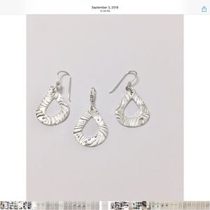 Handcrafted sterling silver earrings and pendant
